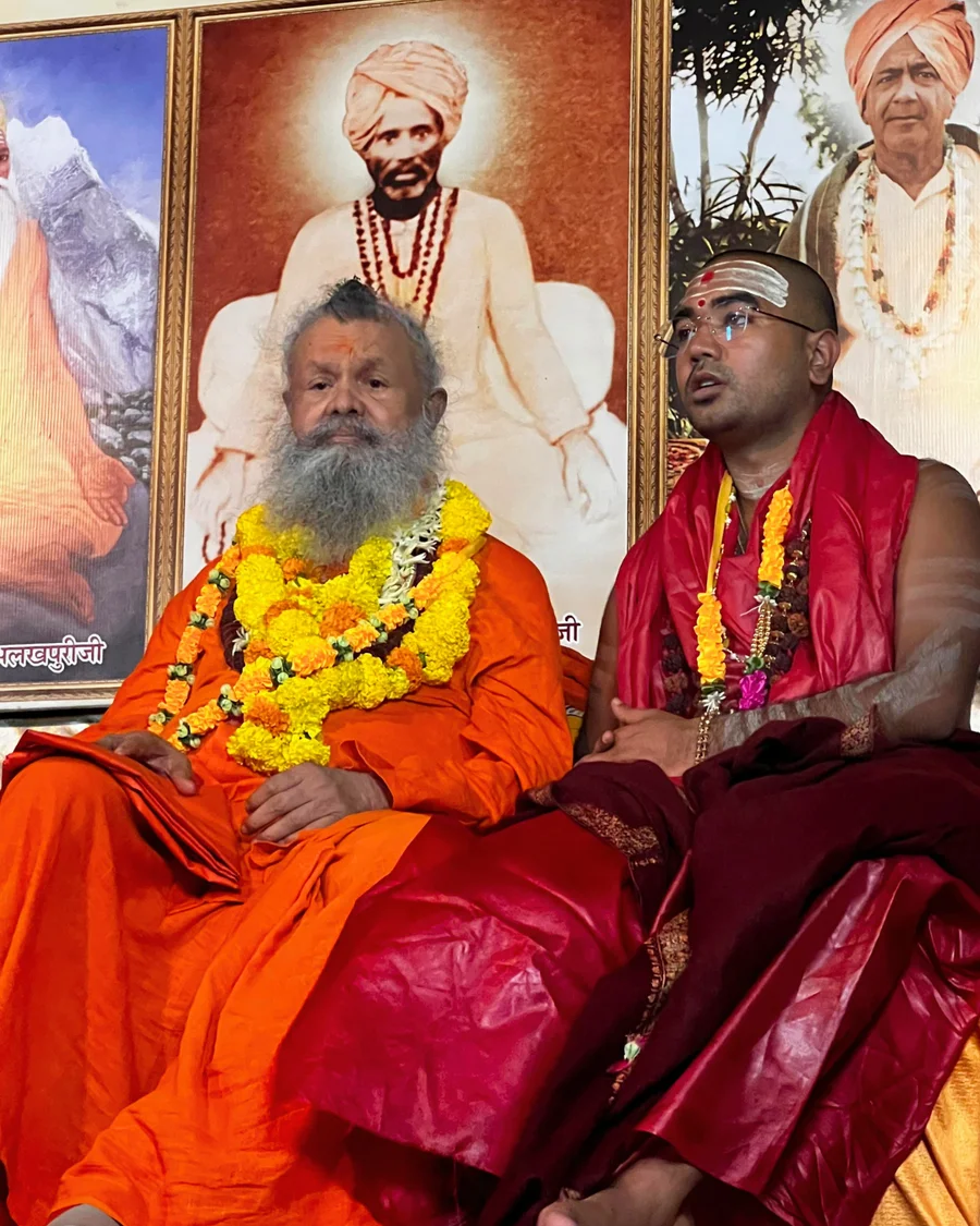 Gurudev His Holiness Vishwaguru Shree Swami Maheshwaranand Puri Ji Maharaj and his successor Shree Swami Avatar Puri Ji Maharaj on stage.
