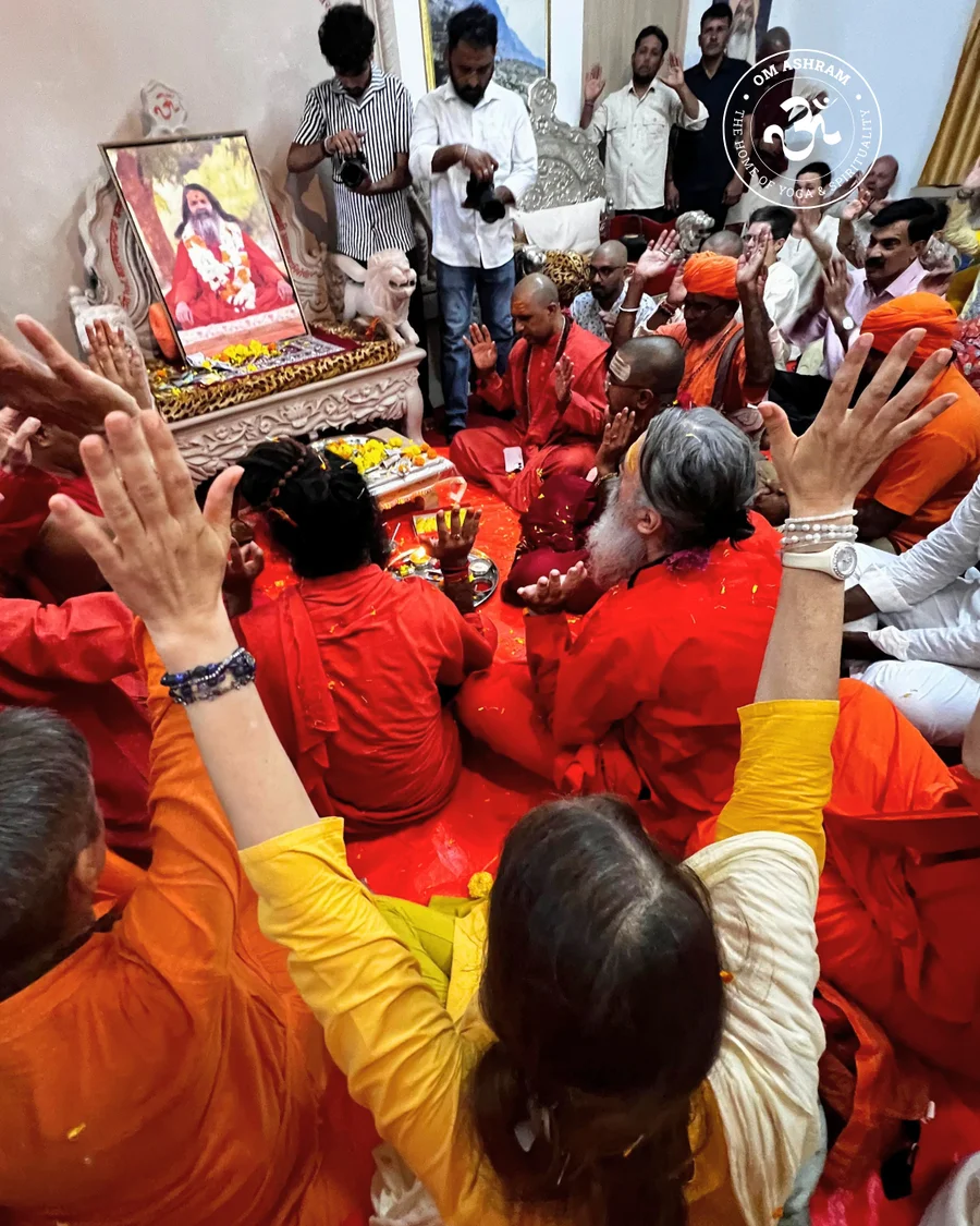A large crowd of devotees cheering and shouting praises at prayer.