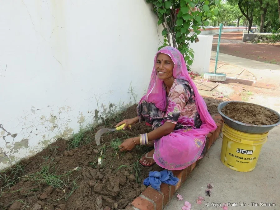 Preparing new ornamental bed behind Ganeshji murti